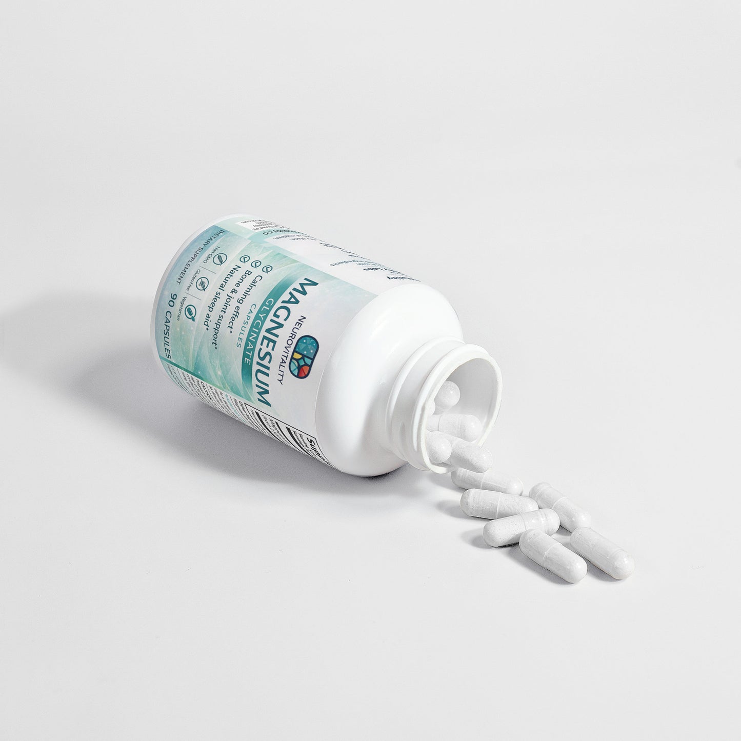 Supplement bottle labeled 'Magnesium' with pills spilling out on a light gray background